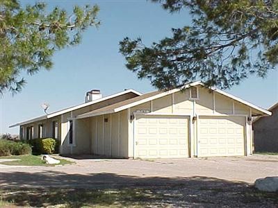 21018 Laguna Road Apple Valley, CA 92308 - Photo 1 of 1 a front view of a house with a yard