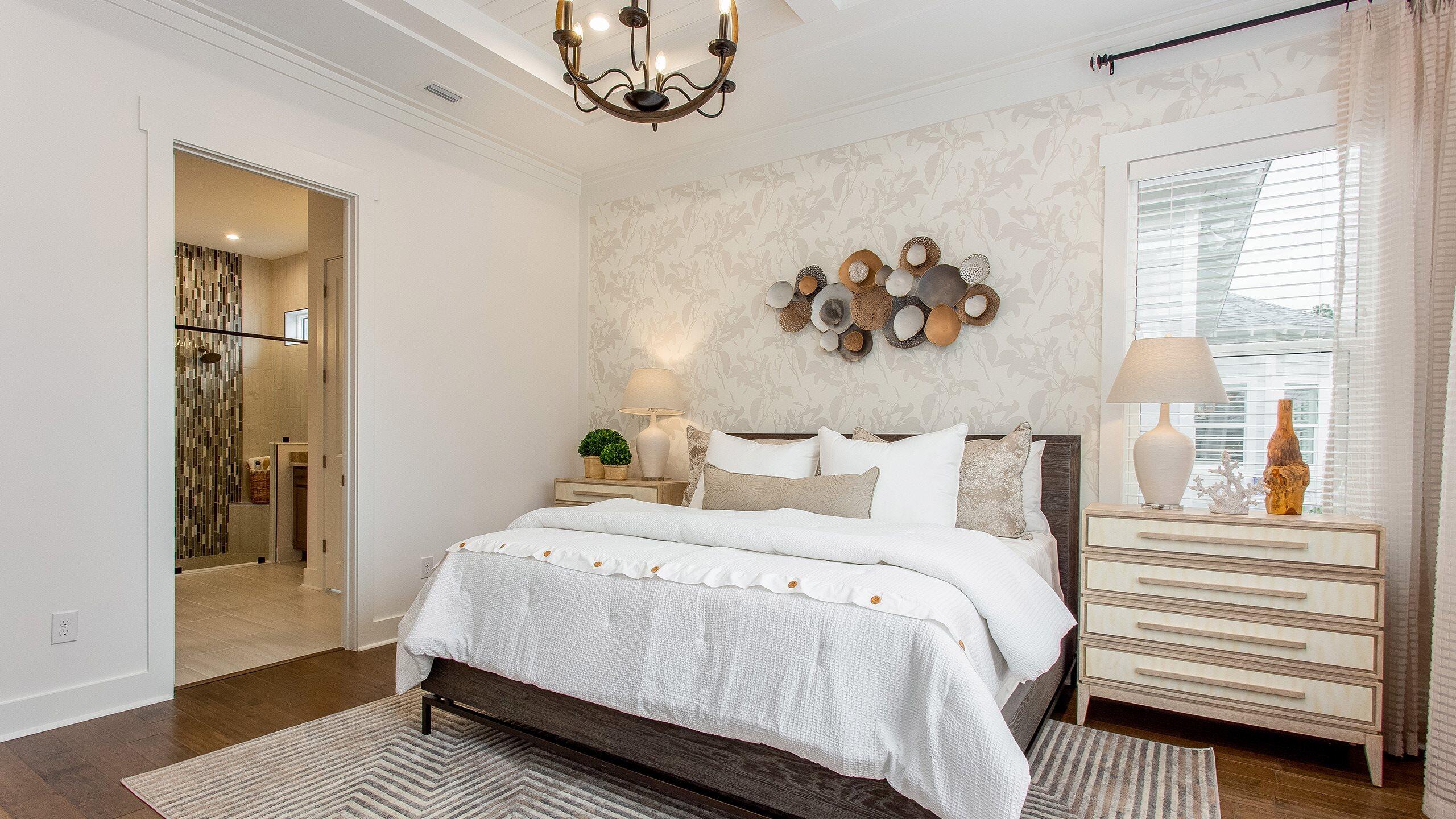 1659 Pathways Dr Inlet Beach Inlet Beach, FL 32461 - Photo 11 of 30 a bedroom with a large bed and a chandelier