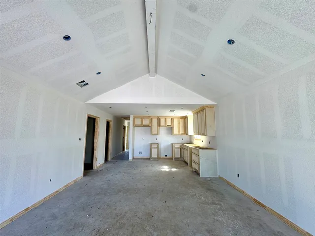 a view of a livingroom with furniture and a window
