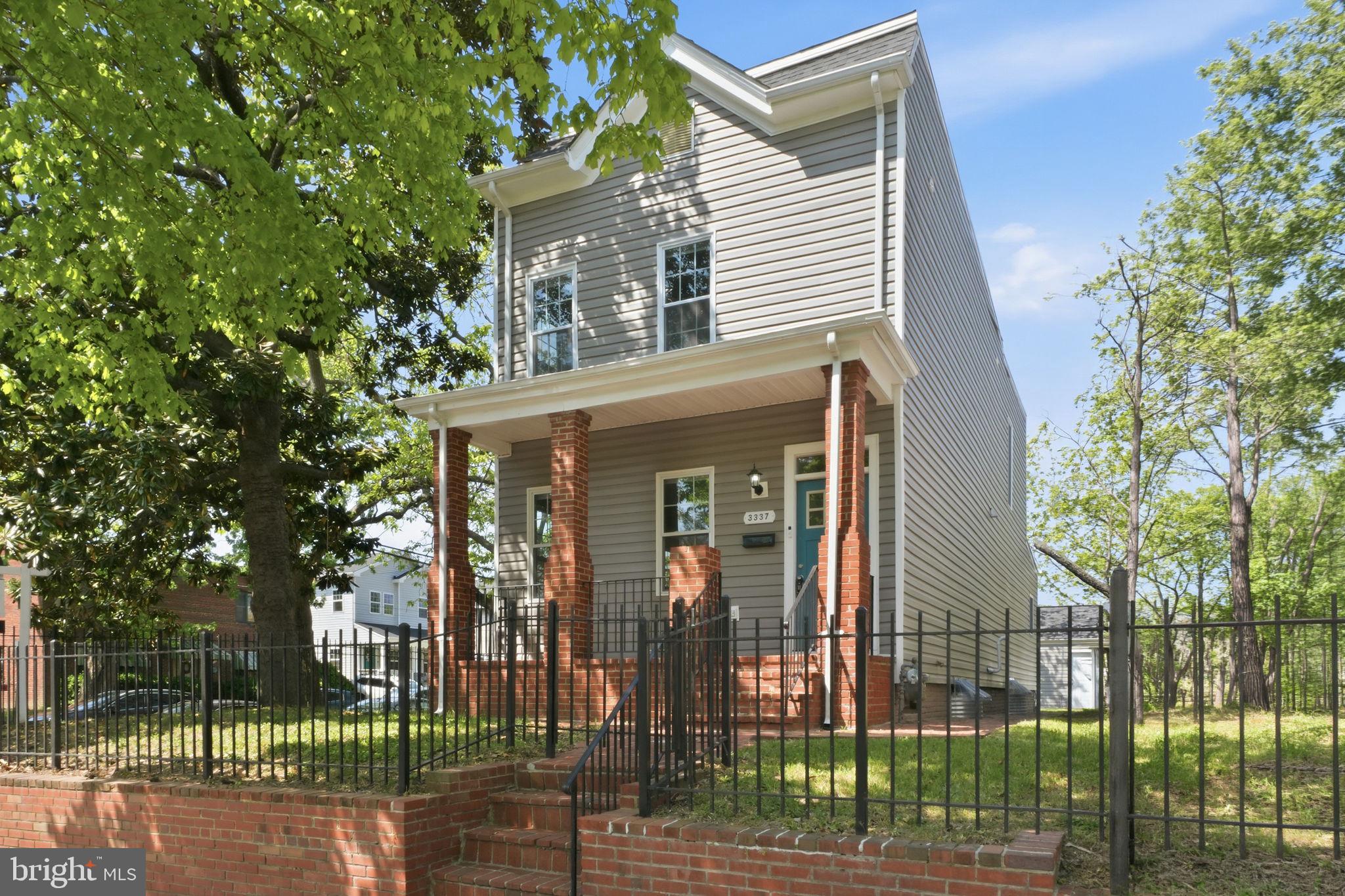 front view of a house with a garden