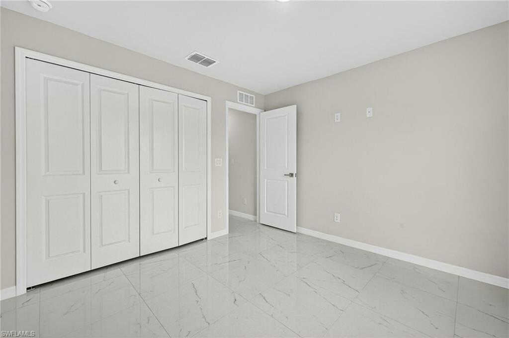 321 Ranier Avenue Lehigh Acres, FL 33974 - Photo 19 of 40 a view of an empty room