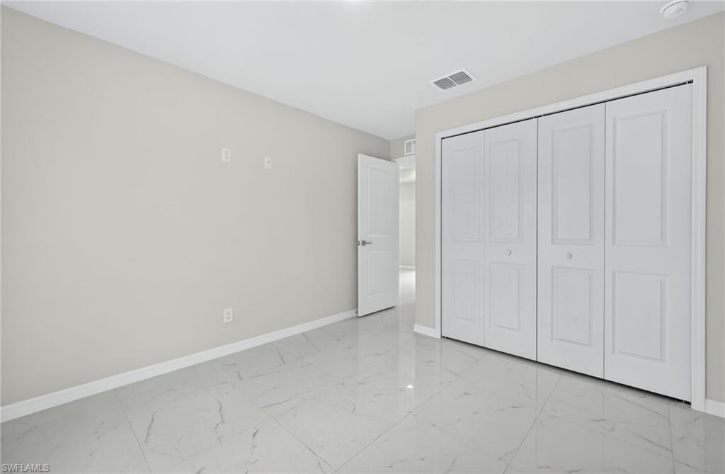321 Ranier Avenue Lehigh Acres, FL 33974 - Photo 21 of 40 a view of an empty room