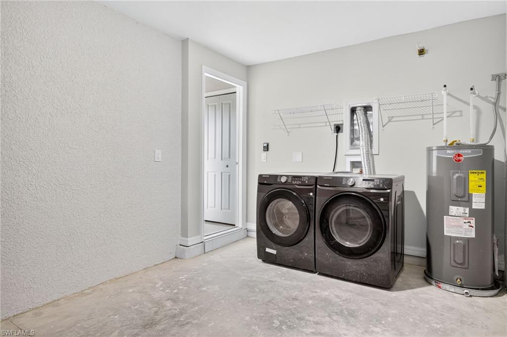 321 Ranier Avenue Lehigh Acres, FL 33974 - Photo 23 of 40 a utility room with dryer and washer