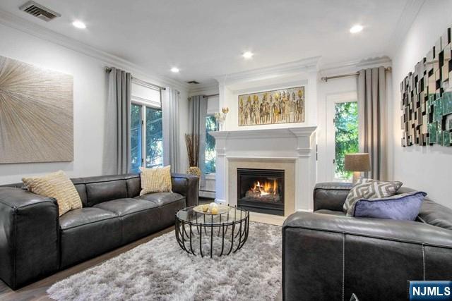 99 Ogle Road Old Tappan, NJ 07675 - Photo 15 of 50 a living room with furniture and a fireplace