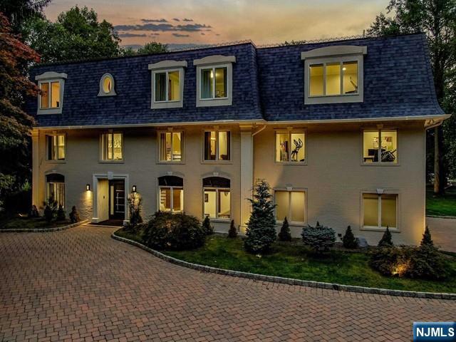 99 Ogle Road Old Tappan, NJ 07675 - Photo 2 of 50 a front view of a house with garden