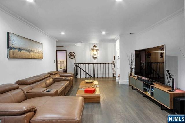 99 Ogle Road Old Tappan, NJ 07675 - Photo 29 of 50 a living room with furniture and a flat screen tv