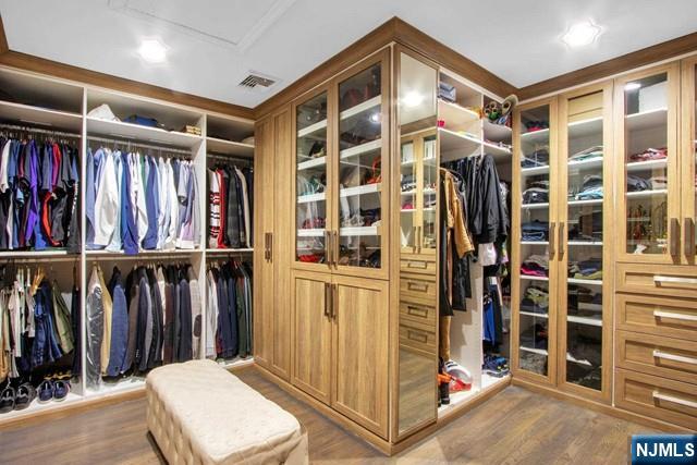 99 Ogle Road Old Tappan, NJ 07675 - Photo 34 of 50 a view of walk in closet with clothes and shoes