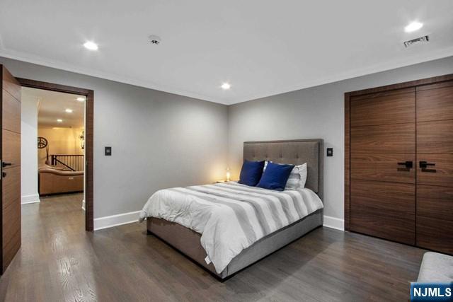 99 Ogle Road Old Tappan, NJ 07675 - Photo 38 of 50 a bedroom with a bed and a walk in closet