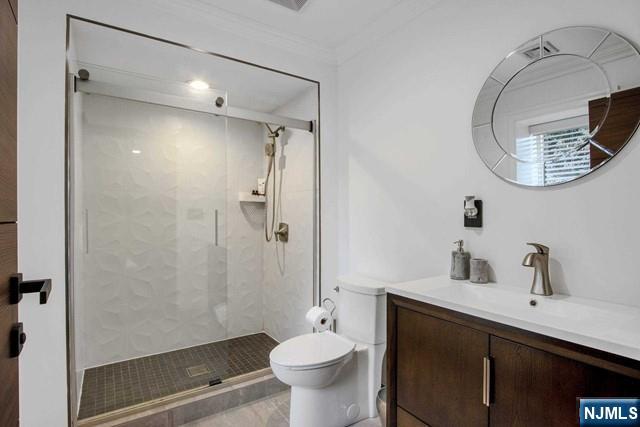 99 Ogle Road Old Tappan, NJ 07675 - Photo 39 of 50 a bathroom with a sink a toilet and shower