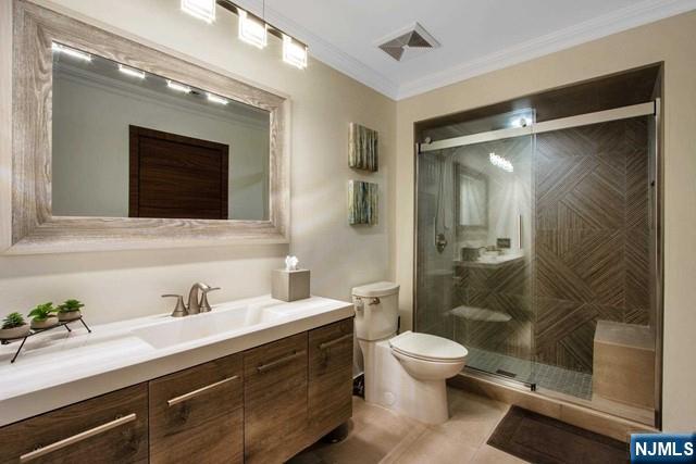 99 Ogle Road Old Tappan, NJ 07675 - Photo 41 of 50 a bathroom with a sink a toilet and shower