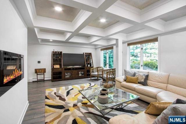 99 Ogle Road Old Tappan, NJ 07675 - Photo 42 of 50 a living room with furniture and a flat screen tv