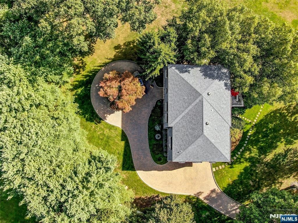 99 Ogle Road Old Tappan, NJ 07675 - Photo 50 of 50 an aerial view of a house with a yard and trees