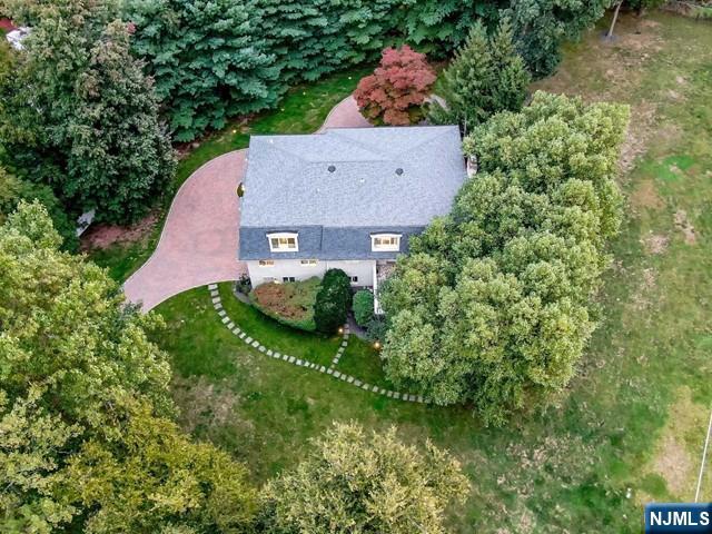 99 Ogle Road Old Tappan, NJ 07675 - Photo 5 of 50 an aerial view of a house with a yard and garden
