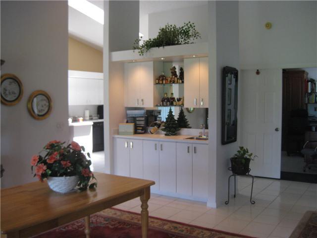 8548 Eagle Run Drive Boca Raton, FL 33434 - Photo 13 of 30 a kitchen with a table and chairs in it