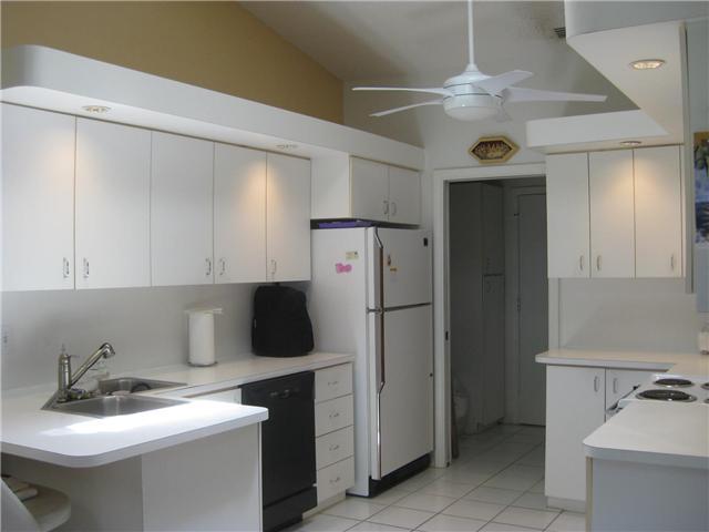 8548 Eagle Run Drive Boca Raton, FL 33434 - Photo 14 of 30 a kitchen with a refrigerator and a sink