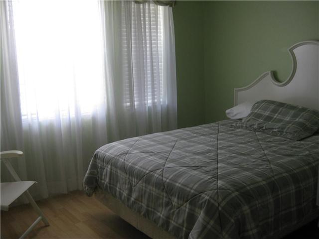 8548 Eagle Run Drive Boca Raton, FL 33434 - Photo 22 of 30 a bedroom with a bed and a window