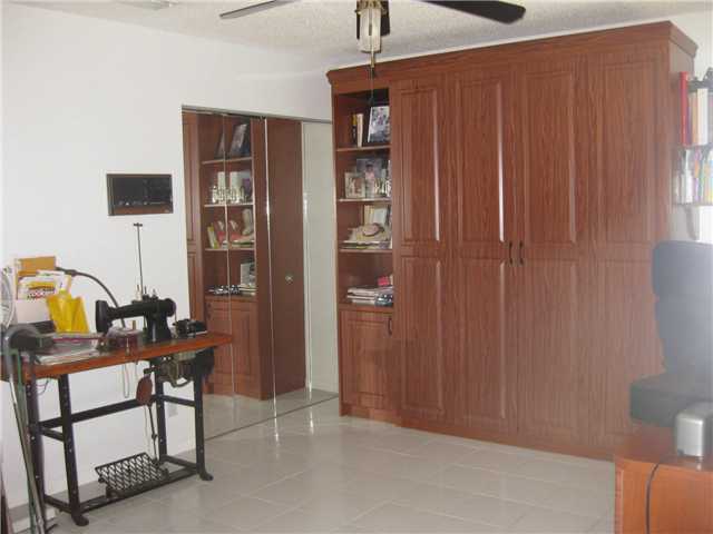 8548 Eagle Run Drive Boca Raton, FL 33434 - Photo 24 of 30 a view of a livingroom with furniture and workspace