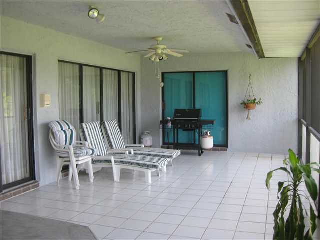 8548 Eagle Run Drive Boca Raton, FL 33434 - Photo 25 of 30 a dining room with furniture and a potted plant