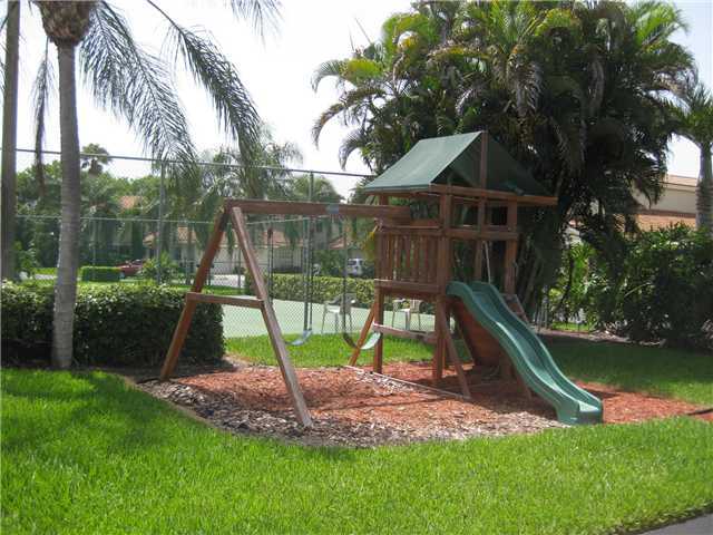 8548 Eagle Run Drive Boca Raton, FL 33434 - Photo 30 of 30 a view of a backyard with a slide