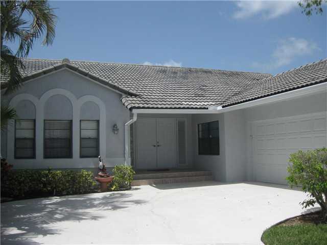 8548 Eagle Run Drive Boca Raton, FL 33434 - Photo 5 of 30 a front view of a house with a yard