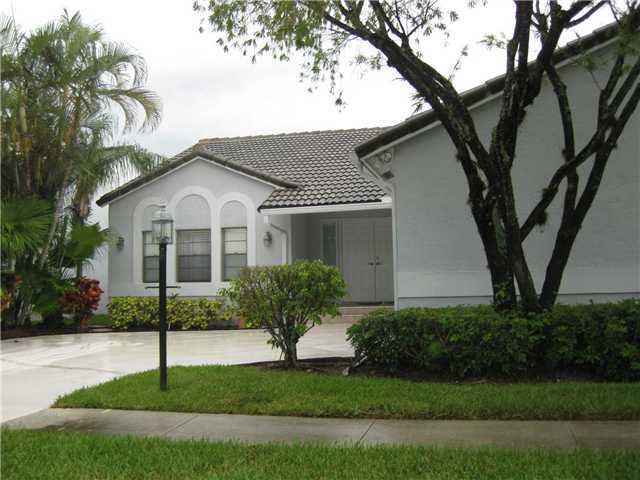 8548 Eagle Run Drive Boca Raton, FL 33434 - Photo 6 of 30 a front view of a house with a yard