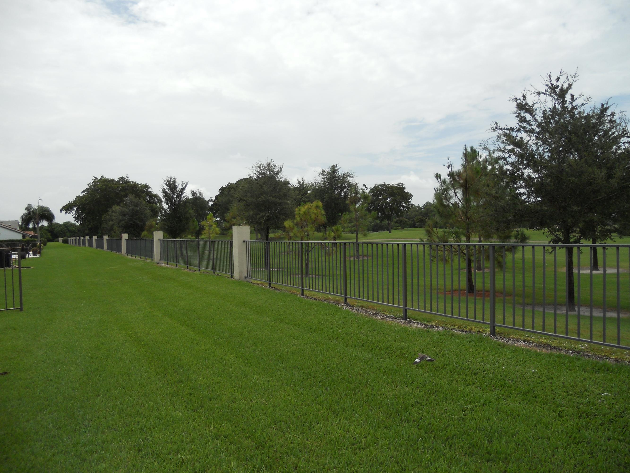 8548 Eagle Run Drive Boca Raton, FL 33434 - Photo 7 of 30 a garden with a fence