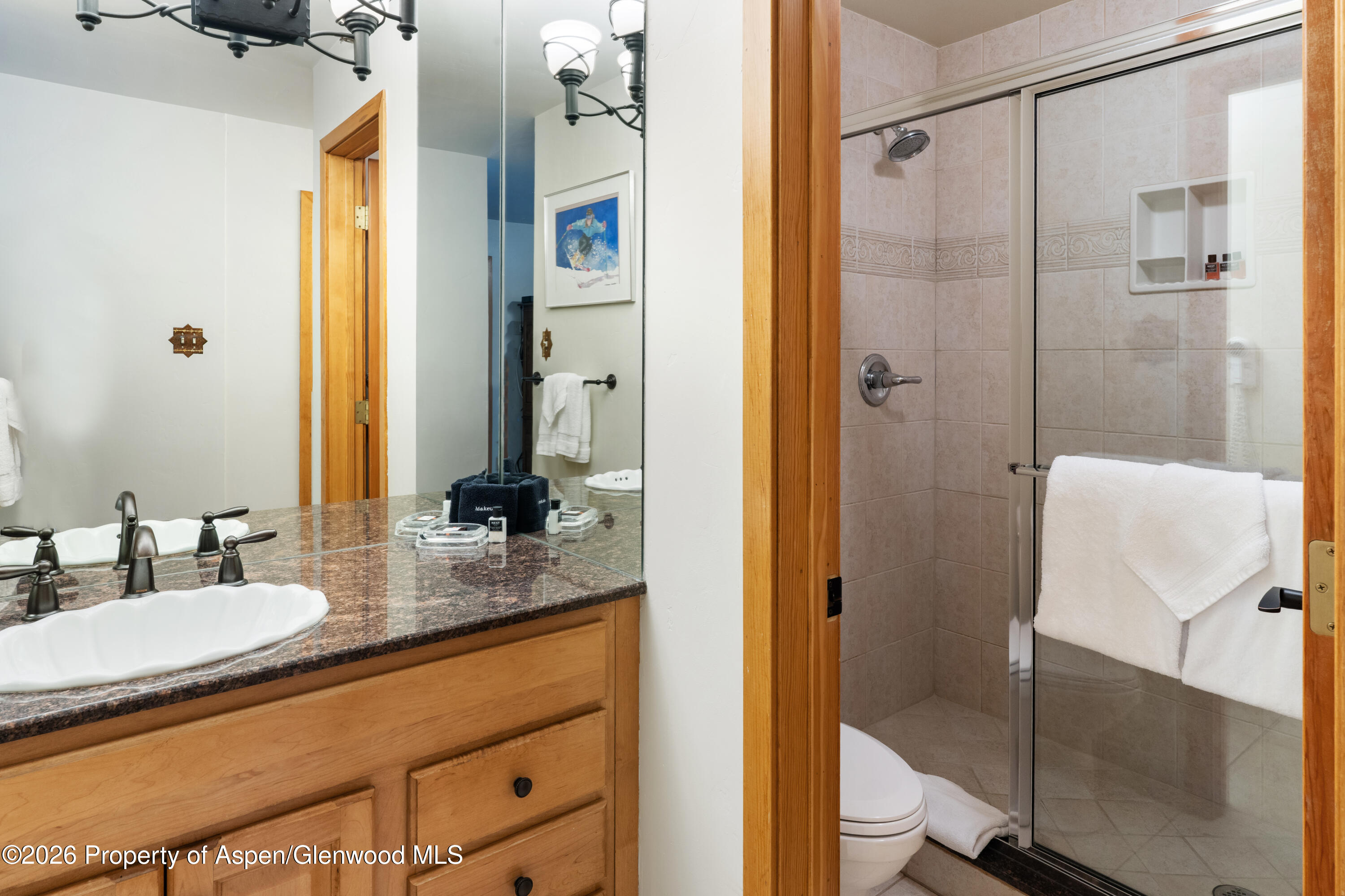 400 Wood Road, Unit 2111H Snowmass Village, CO 81615 - Photo 9 of 16 a bathroom with a granite countertop sink and a mirror