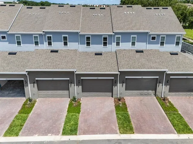 a aerial view of a house with yard
