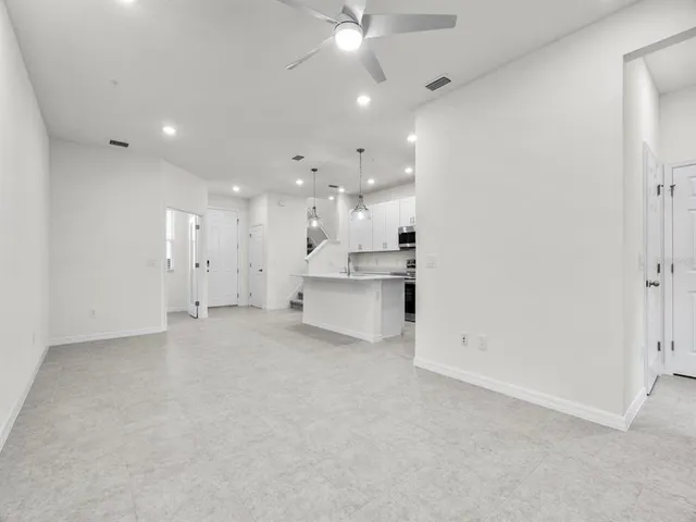 a view of a kitchen with a sink and cabinets