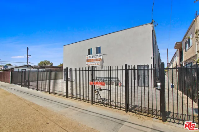 a view of a balcony with wooden fence