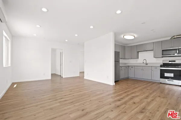 a view of kitchen with wooden floor