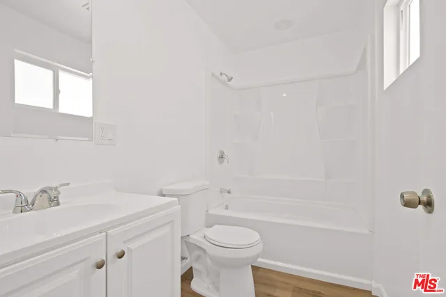 a bathroom with a sink toilet and bathtub