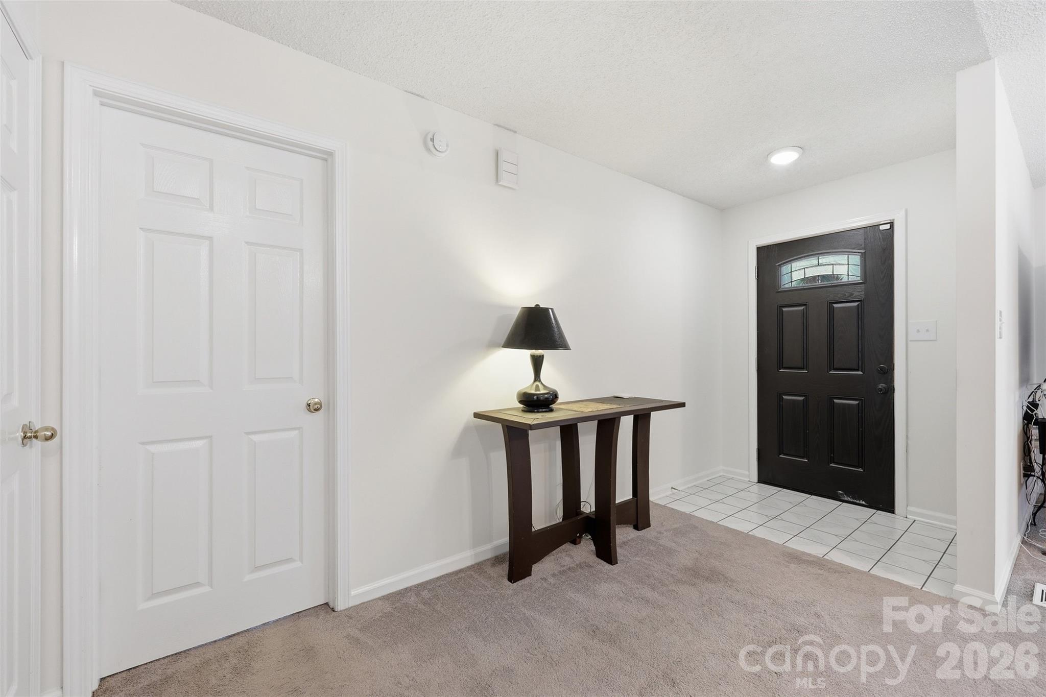 913 Pleasant Ridge Road Fort Mill, SC 29715 - Photo 3 of 40 a bedroom with a bed and a table in it