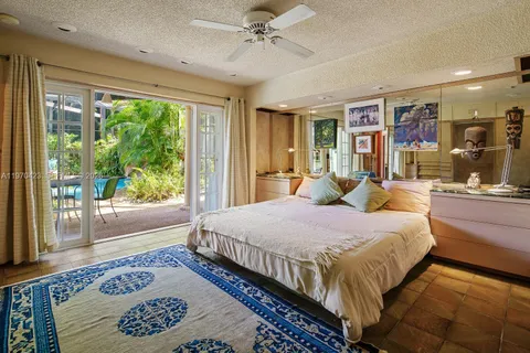 a view of a backyard with swimming pool