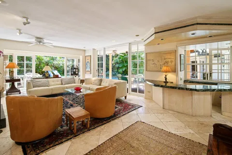 a living room with furniture window and wooden floor