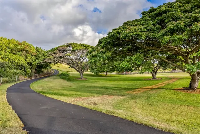 a living room with furniture and floor to ceiling windows