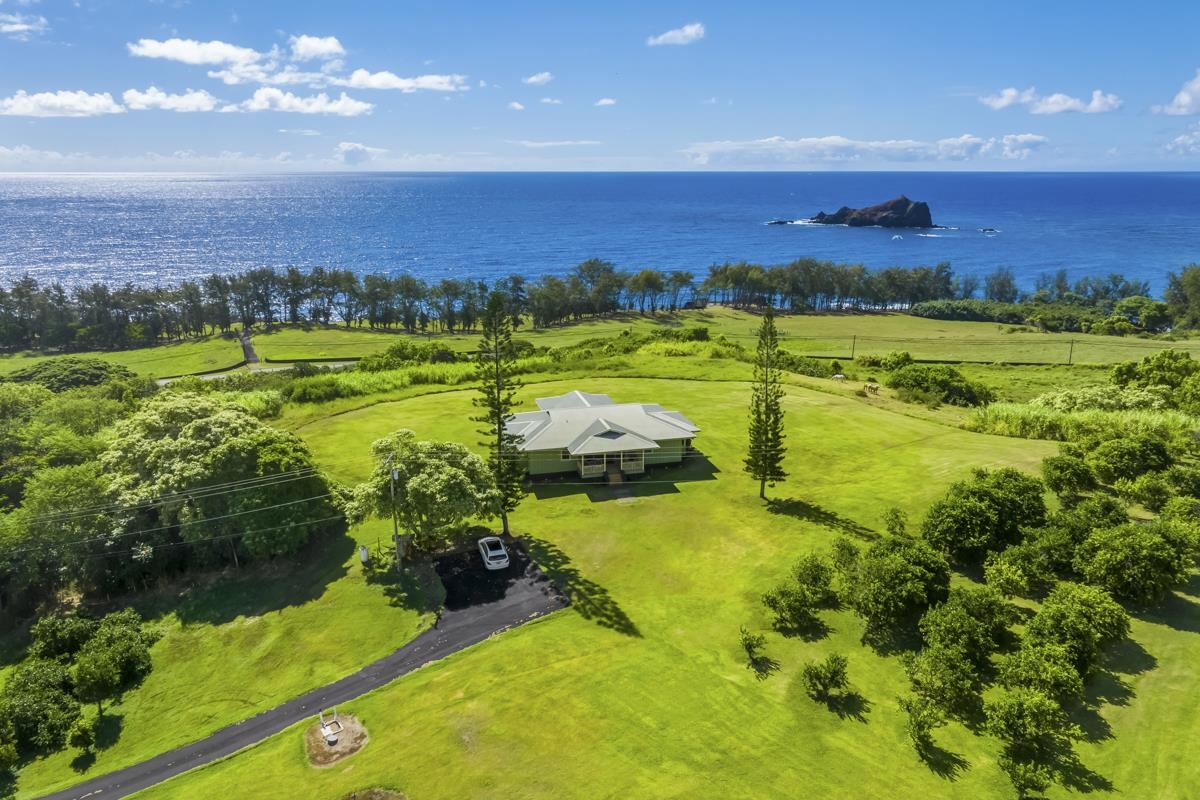 5670 Hana Highway Haiku, HI 96708 - Photo 13 of 30 a view of an ocean and a yard