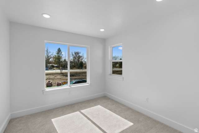 248 West 2920th Street South Logan, UT 84321 - Photo 47 of 47 Recessed lighting illuminates the room, featuring two windows and wall-to-wall carpeting