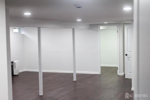 a view of an empty room with a bathroom