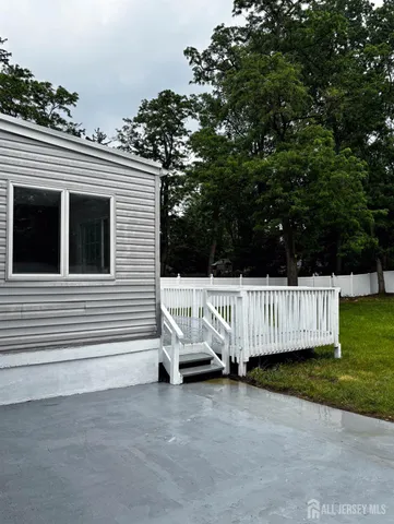 a view of a roof deck with a fence