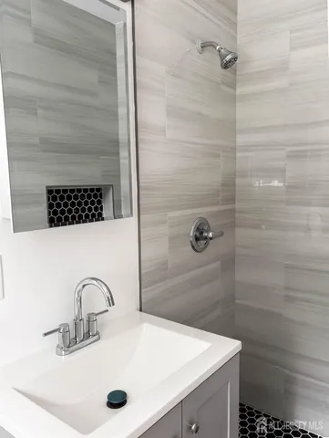 a bathroom with a sink and a mirror
