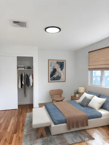 a bedroom with a bed and a couch