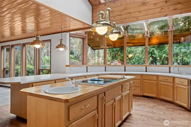 a kitchen that has a sink and a large window