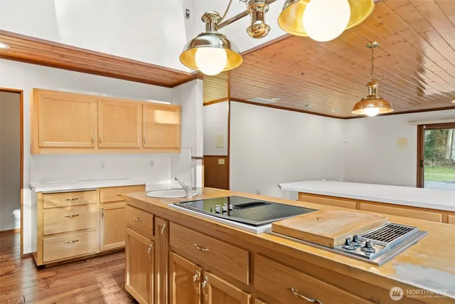 a kitchen with a sink cabinets and appliances
