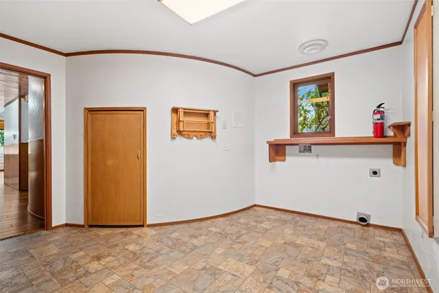 a bathroom with a sink a toilet a mirror and shower