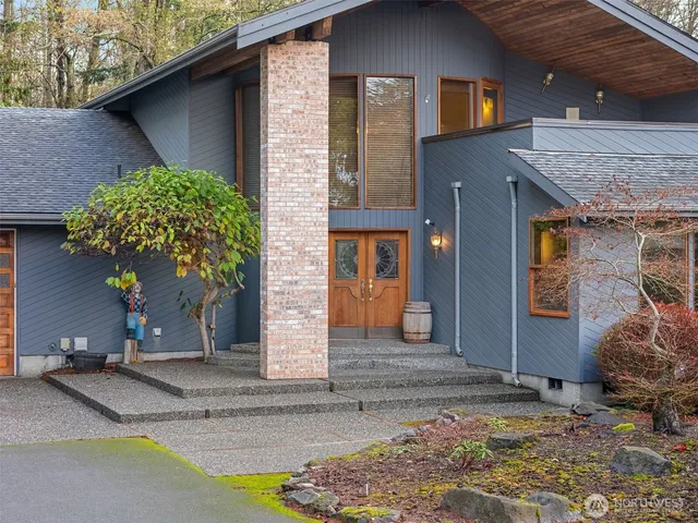 a front view of a house with garden