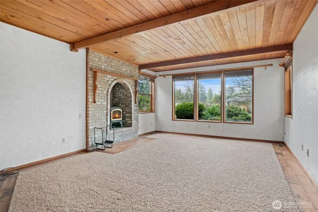 a view of a room with furniture and a fireplace