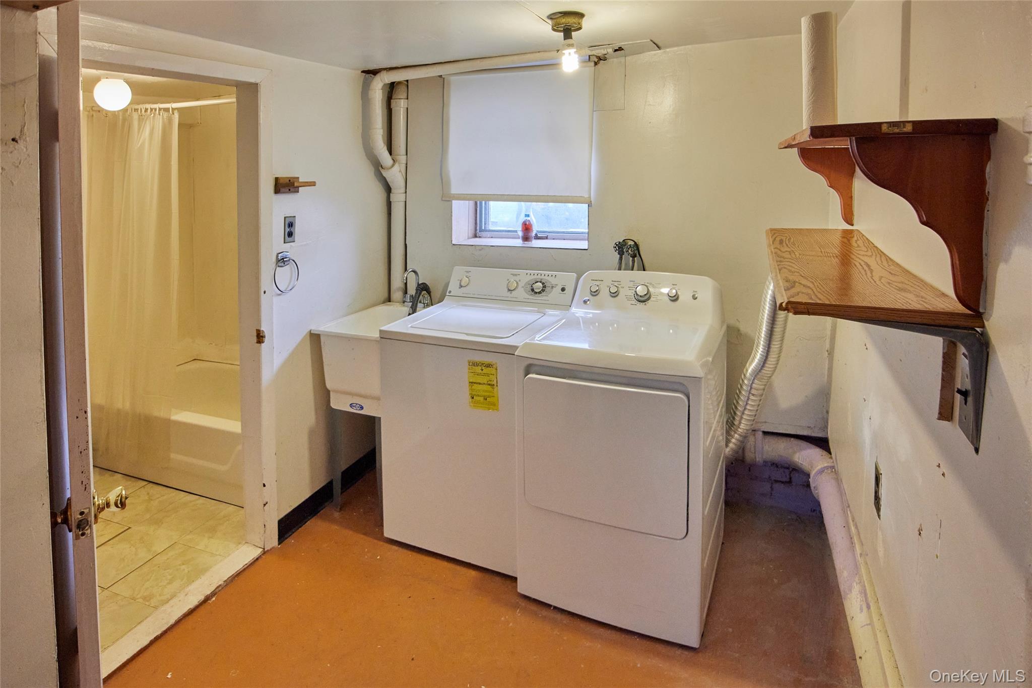 728 Frost Avenue Peekskill, NY 10566 - Photo 16 of 18 a utility room with dryer and washer
