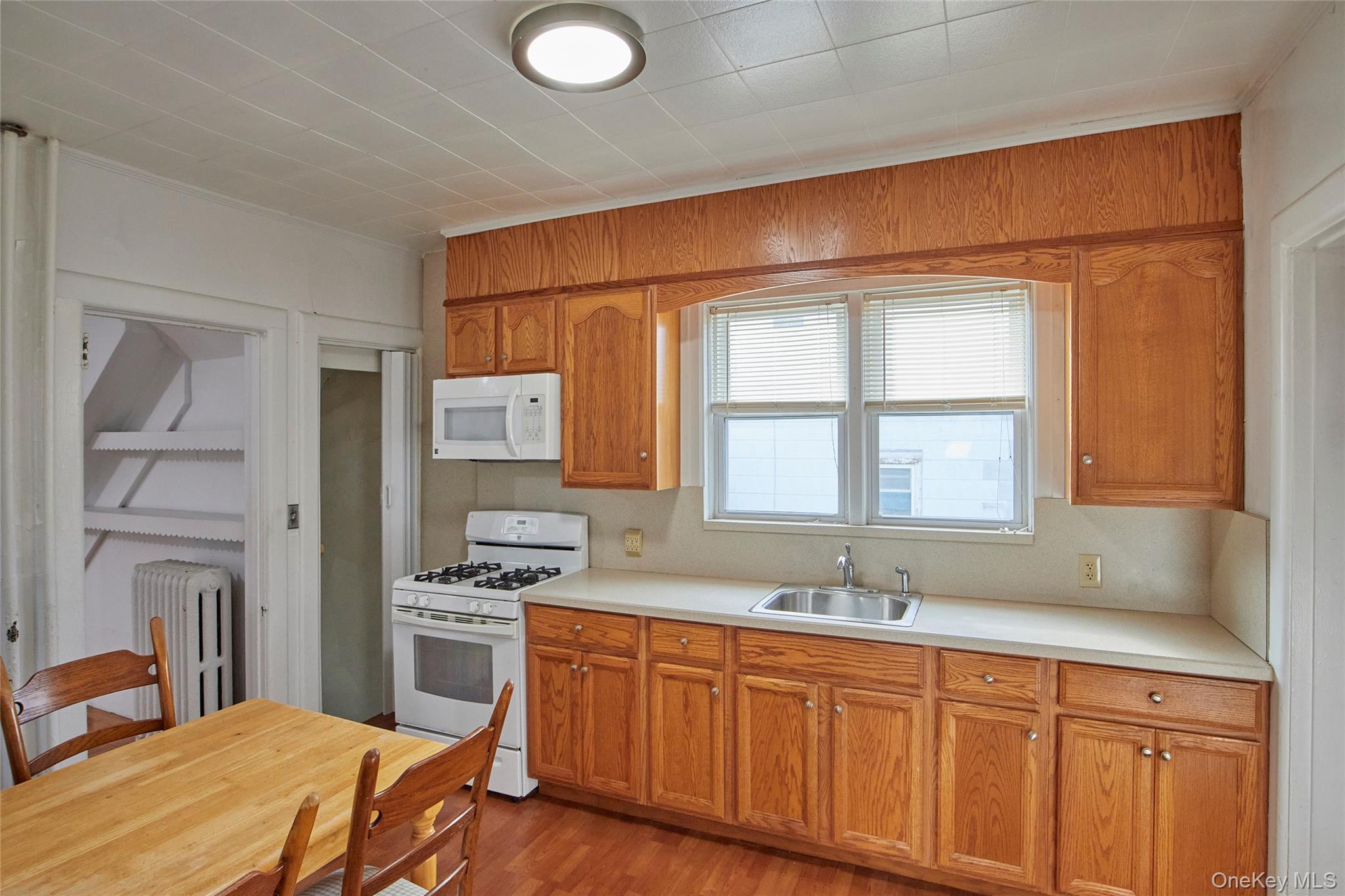 728 Frost Avenue Peekskill, NY 10566 - Photo 3 of 18 a bedroom with a bed and a sink