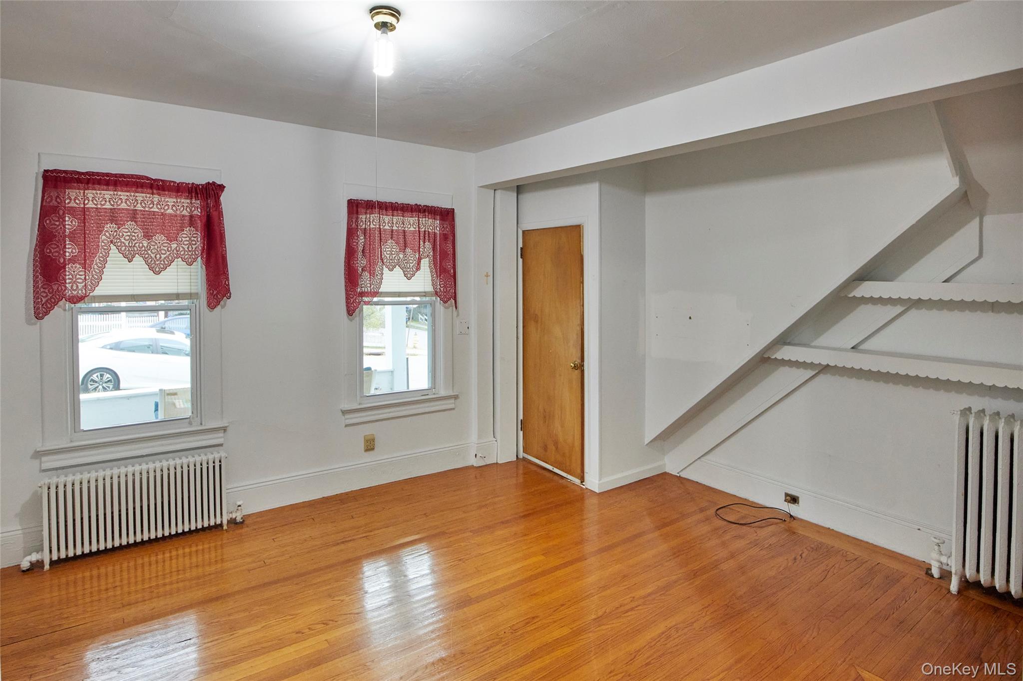 728 Frost Avenue Peekskill, NY 10566 - Photo 6 of 18 a view of empty room with wooden floor